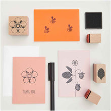 Load image into Gallery viewer, Collection of rubber stamps and ink pads on a white background