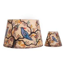 Load image into Gallery viewer, Two lampshades with bird and branch design on a beige background