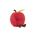 Plush toy shaped like a red apple with a smiling face on a white background
