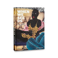 This image features the cover of the book "When We See Us: A Century of Black Figuration in Painting," published by Thames & Hudson. The cover artwork is a striking representation of Black figuration, showcasing a detailed and vibrant painting of a figure dressed in a leopard print garment, surrounded by lush greenery and abstract patterns.