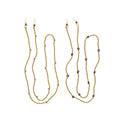 Gold necklaces with small pink beads on a white background