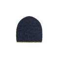 Blue knitted beanie on a light gray background