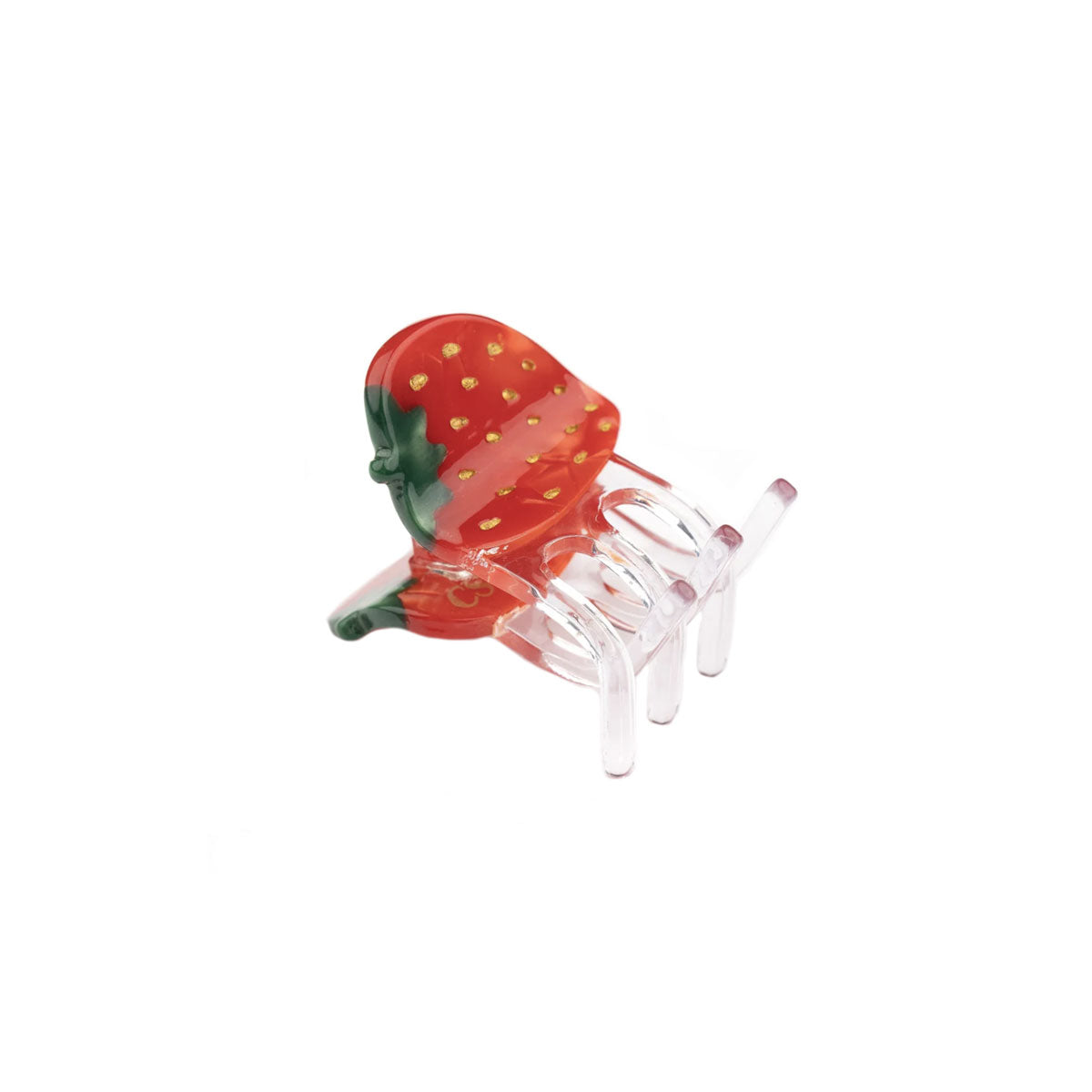 Strawberry-shaped hair clip on a white background