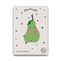Green pear-shaped iron on patch with pink blushes on a white card with star patterns, brand 'Petit Bateau' visible.
