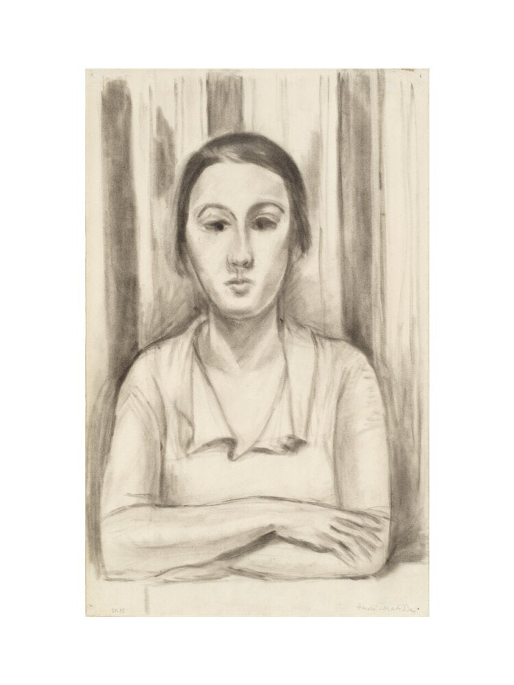 A Woman with her arms on a table