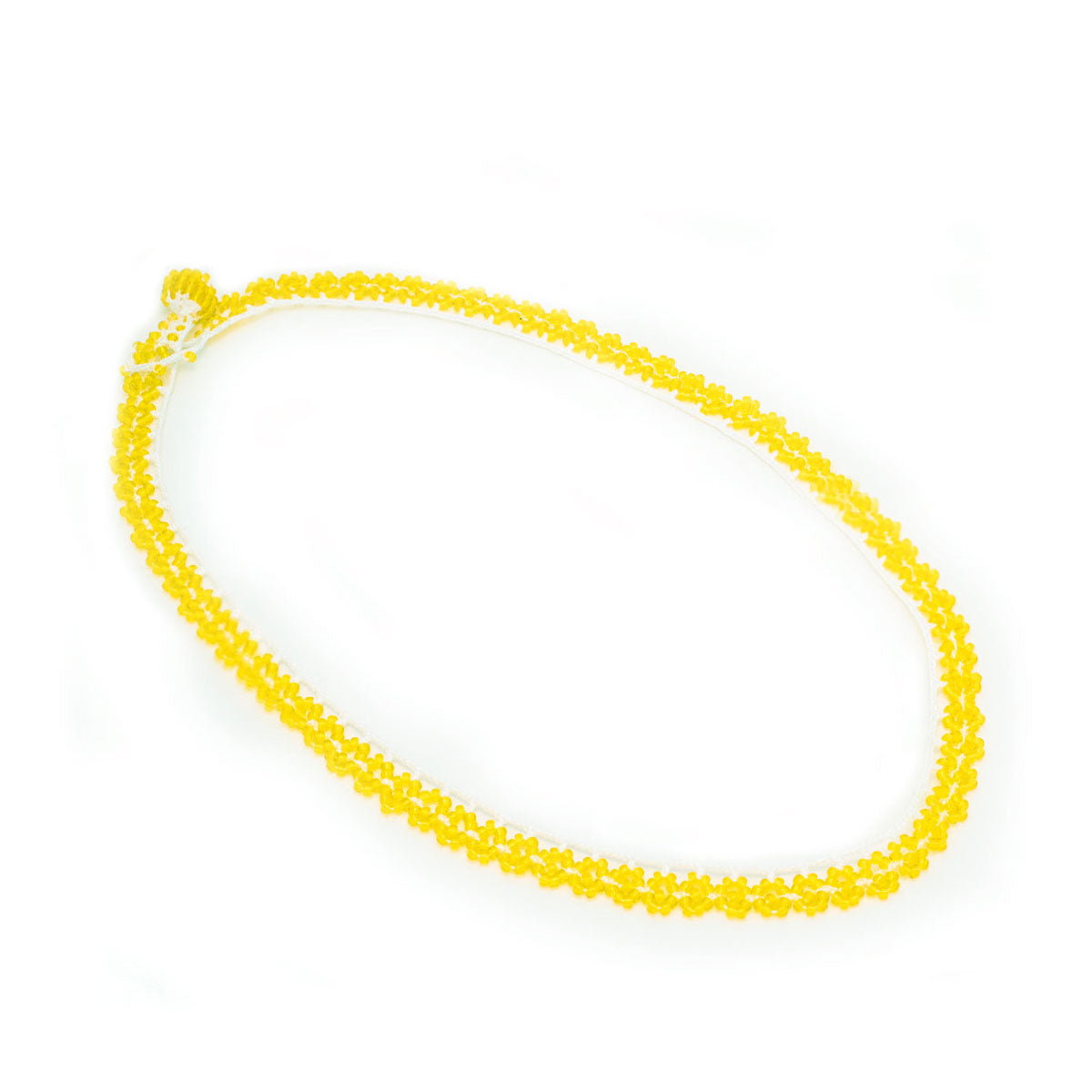 Yellow beaded necklace on a white background